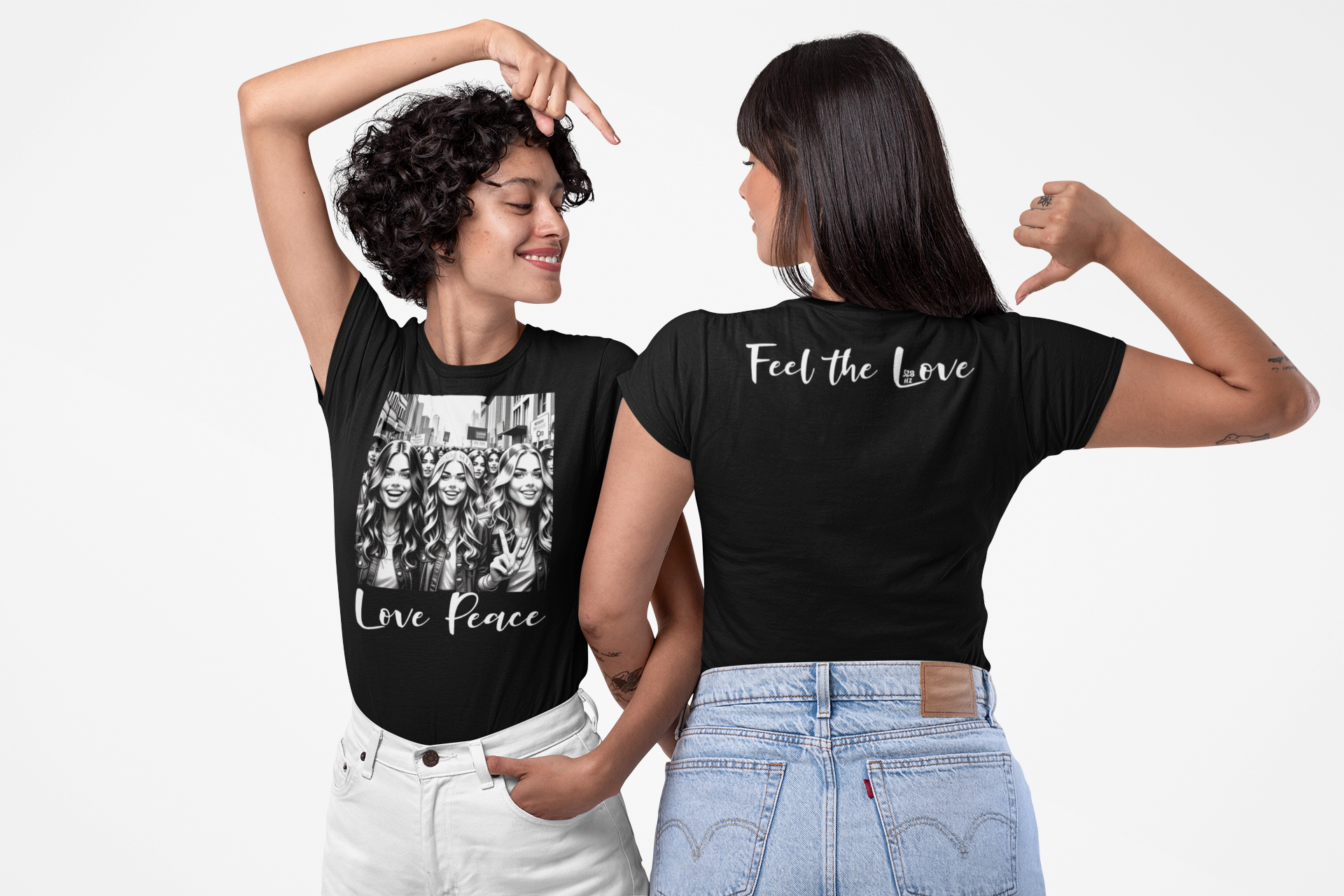 Two women wearing black t-shirts with printed designs and text.